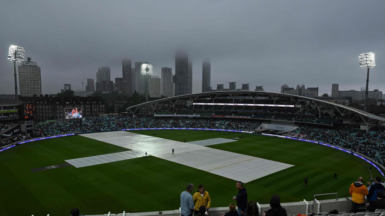 Members of the public wait for the start of the game. Photo by Glyn KIRK / AFP