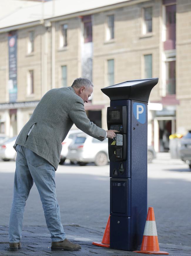 A motorist in Salamanca coming to terms with the new parking meters being rolled out around Hobart last year. Picture: MATHEW FARRELL