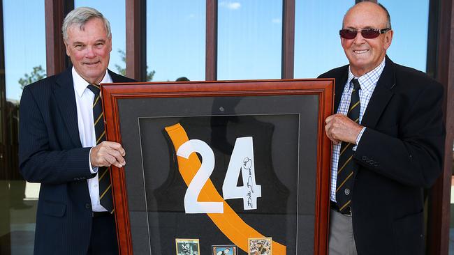 Francis Bourke and Dick Clay hold Bill Barrot's old jumper. Picture: Ian Currie
