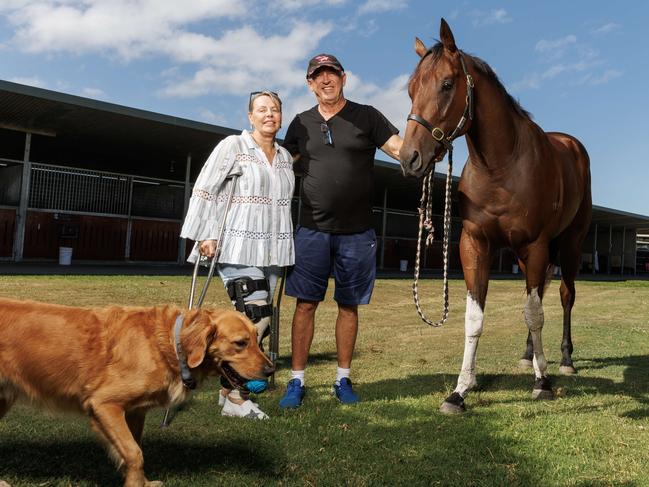 Trainer Rob Heathcote with wife Vicky and sprinter Pretty Dubious at Eagle Farm stables. Picture Lachie Millard