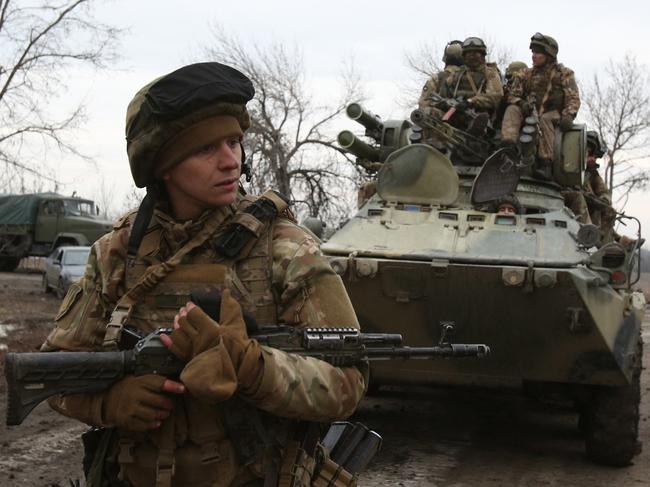 Ukrainian servicemen get ready to repel an attack in Ukraine's Lugansk region. Picture: AFP