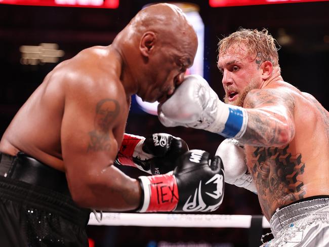 ARLINGTON, TEXAS - NOVEMBER 15: (L-R) Mike Tyson and Jake Paul fight during LIVE On Netflix: Jake Paul vs. Mike Tyson at AT&T Stadium on November 15, 2024 in Arlington, Texas. (Photo by Al Bello/Getty Images for Netflix Ã&#130;Â© 2024)