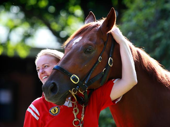 Golden Slipper winner Capitalist with strapper Sarah Kirk at Peter Snowden's Randwick stables on Sunday. Picture: Cameron Richadson