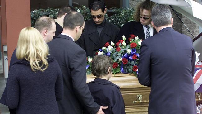 Mourners at the 2004 funeral of police informers Terence and Christine Hodson. Picture: David Crosling