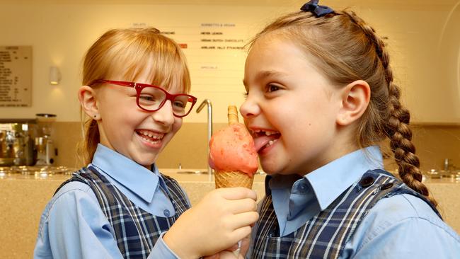 Rebecca Felcher and Harper North, both aged 7, tuck into a gelato at Bottega Gelateria’s new store in Glenelg. Picture: Kelly Barnes.