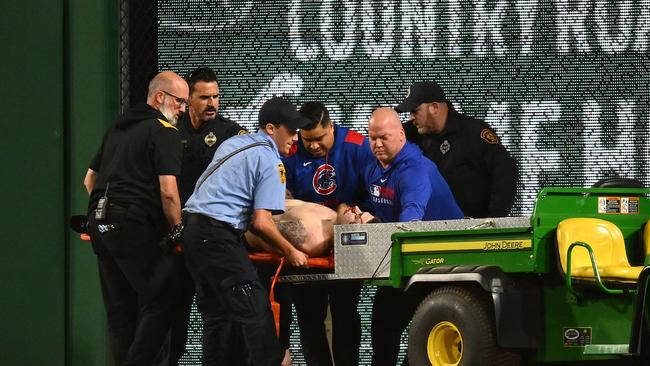 Markwood is carted off the field after falling from the stands. Picture: Joe Sargent/Getty