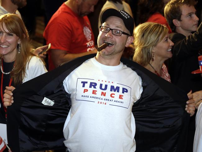 Jake Viano shows his support for President-elect Donald Trump at the Colorado Republican election night party Wednesday, Nov. 9, 2016, in Greenwood Village, Colo. (AP Photo/Jack Dempsey)