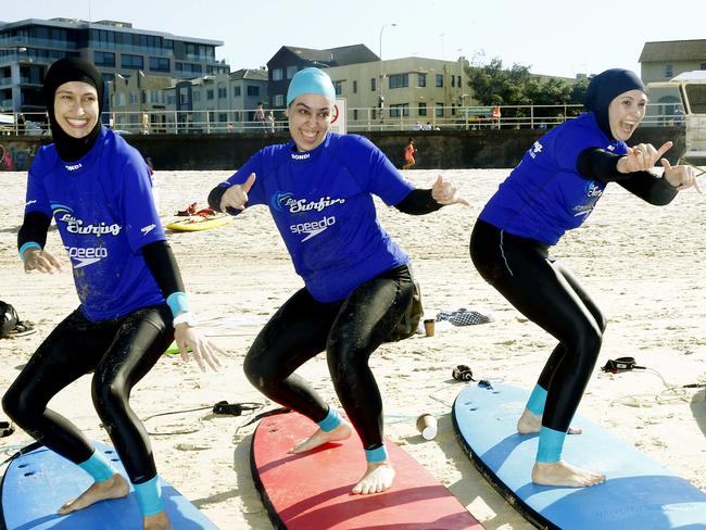 Fadila Chafic, Meltem Kilicoglu and Anisa Buckley practice on the beach. Picture: John Appleyard