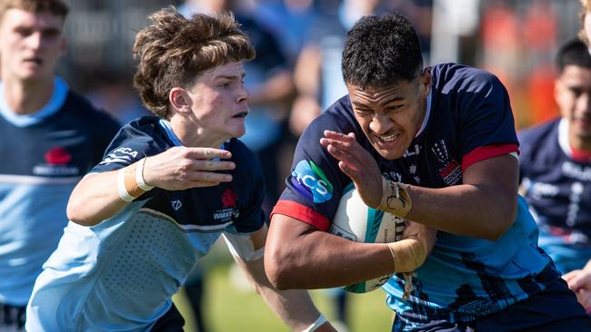 20th September 2022. News Local. SportDaceyville, Sydney, NSW, Australia.Pics by Julian Andrews.Rugby Union Action from the NSW Waratahs Under 18 team v Melbourne Rebels.Picture shows:WaratahÃs player(s):  Joey Fowler tacklesRebels player(s): Captain Leafi Talataina