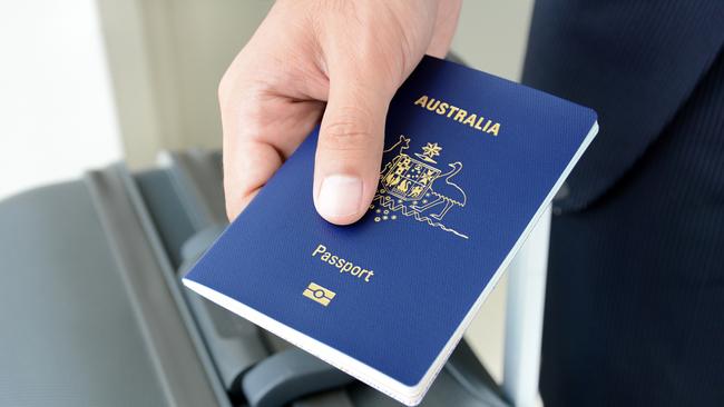 Hands giving passport (of Australia)