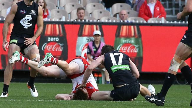 Gary Rohan lands awkwardly after his collision with Sam Rowe in the third term. Picture: Wayne Ludbey