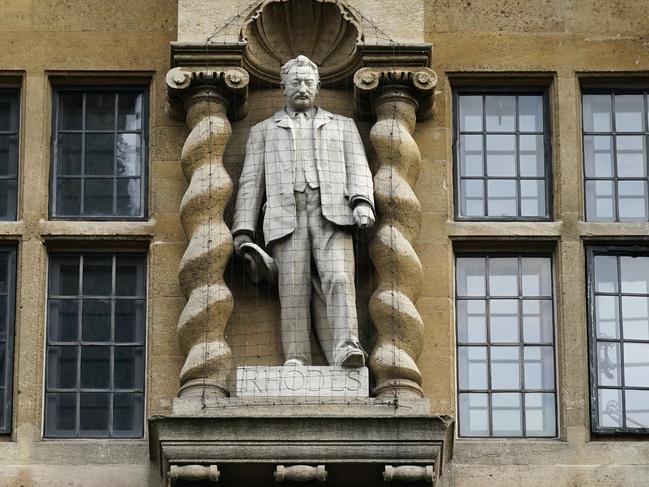 OXFORD, ENGLAND - JUNE 09: The Cecil John Rhodes statue is seen as people gather outside University of Oxford's Oriel College during a protest called by the Rhodes Must Fall campaign on June 09, 2020 in Oxford, England. The Rhodes Must Fall campaign protests outside University of Oxford's Oriel College where a statue of imperialist Cecil John Rhodes looks out over the High Street and the college's front door. (Photo by Christopher Furlong/Getty Images)