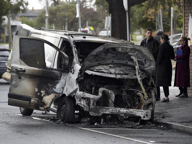 A torched van outside a tobacconist shop on Belair Ave, Glenroy. Picture: Andrew Henshaw