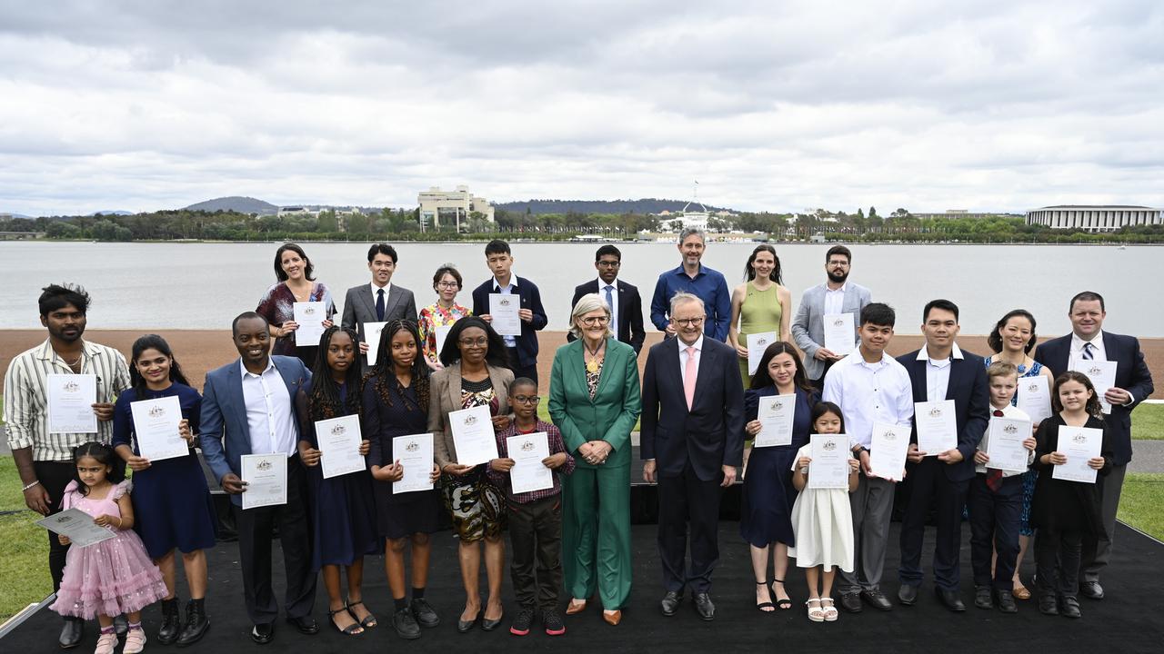 The country’s newest citizens celebrating Australia Day. Picture: NewsWire / Martin Ollman