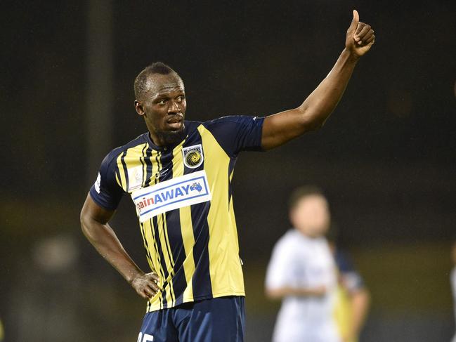 Usain Bolt acknowledges the crowd as he celebrates scoring his second goal for the Central Coast Mariners on Friday night. Picture: AFP