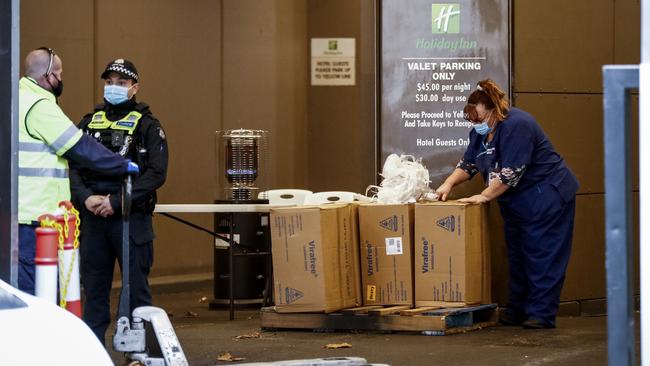 Medical staff at the Holiday Inn Hotel in Melbourne take delivery of isolation gowns on Wednesday. Picture: Getty Images