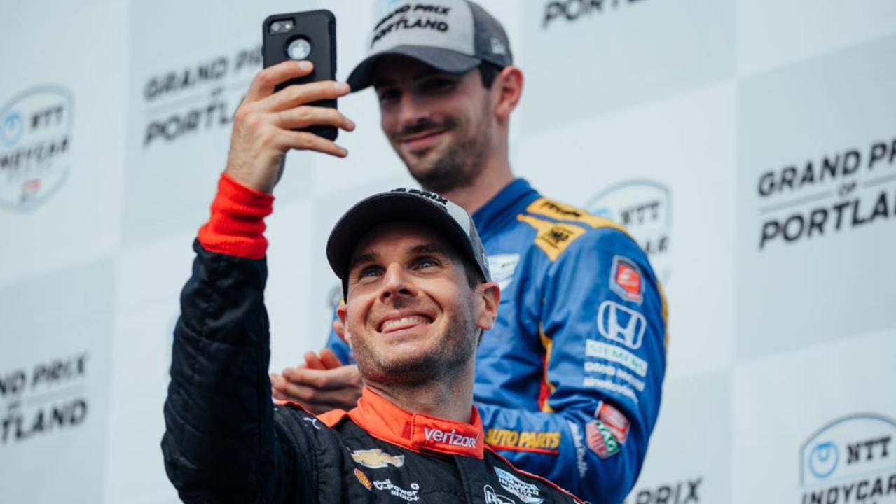 A happy Power videos fans as he takes the podium at Portland. Pic: Stephen King/IndyCar