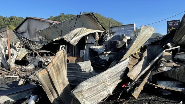 A burnt vehicle rests among the wreckage of Croft Auto after the May 31 fire. Picture: Alison Paterson