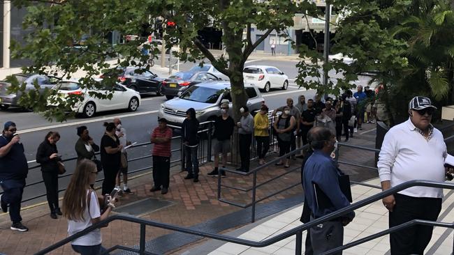 Worried residents at the Centrelink Bankstown. Picture: Lawrence Machado