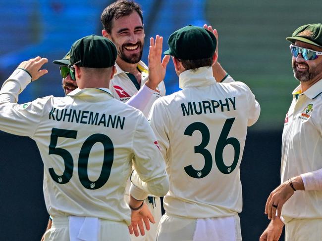 Australia's Mitchell Starc (3L) celebrates with teammates after taking the wicket of Sri Lanka's Kamindu Mendis during the third day of the first Test cricket match between Sri Lanka and Australia at the Galle International Cricket Stadium in Galle on January 31, 2025. (Photo by Ishara S. KODIKARA / AFP)