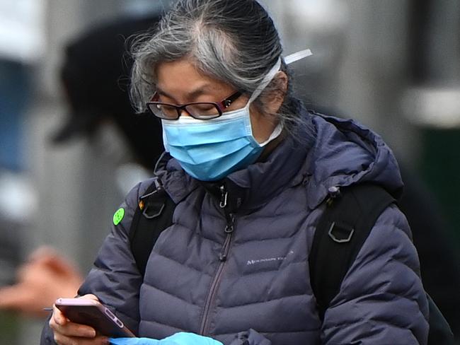 A woman wearing a face mask in Melbourne. Picture: Getty Images