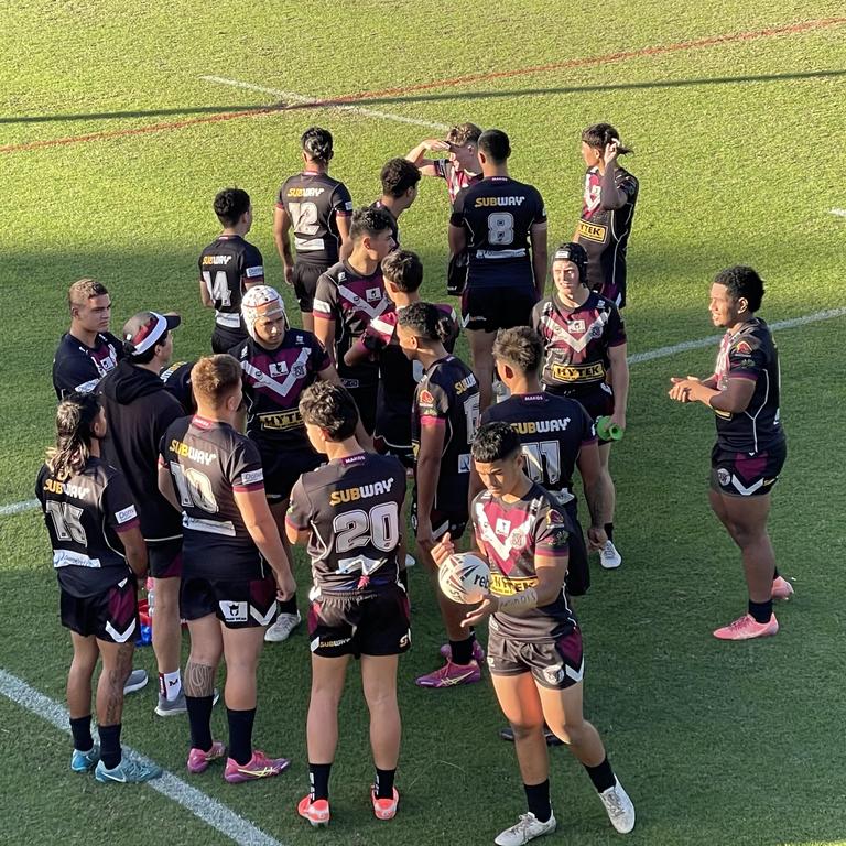 Marsden SHS players at halftime against Stretton SC.