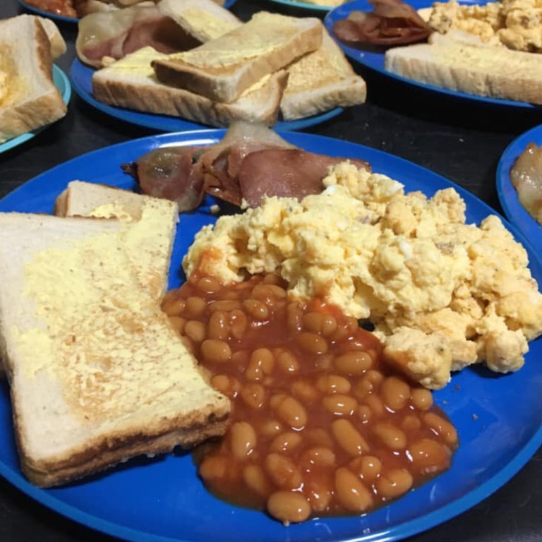 The family decided to have breakfast for dinner, going through three dozen eggs, several loaves of bread and an ample tins of baked beans. Picture: Facebook/thebonellfamily