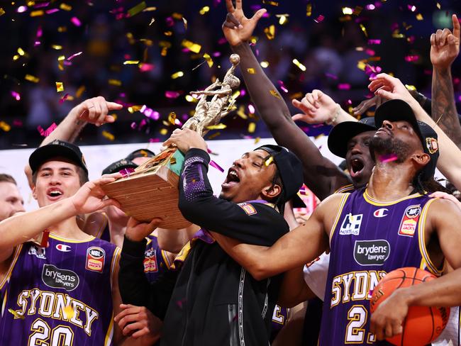 Jaylen Adams lifts the trophy as the Kings celebrate winning the Grand Final series in 2022. Picture: Getty Images