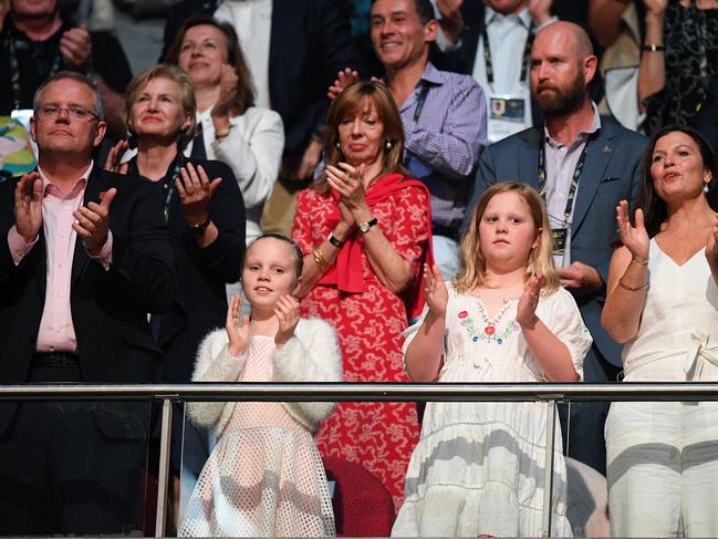 Australian Prime Minister Scott Morrison and wife Jenny (right) with their daughters Abbey and Lily are seen in the crowd during the closing ceremony. Picture: AAP Image/Dan Himbrechts