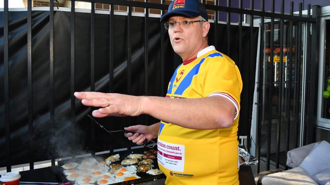 Out! Only ScoMo is allowed to hold the prime ministerial spatula. Photo: AAP