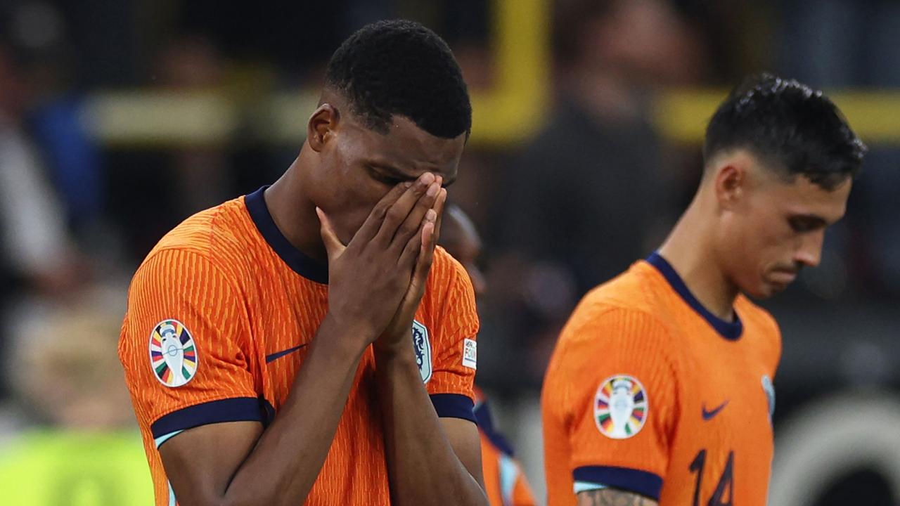 Netherlands' defender #22 Denzel Dumfries reacts after losing the UEFA Euro 2024 semi-final match. (Photo by Adrian DENNIS / AFP)