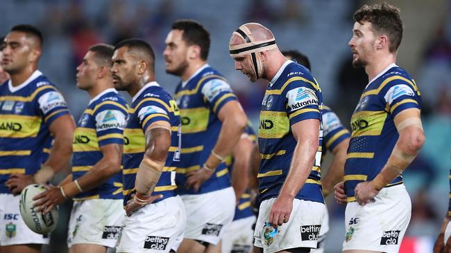 Eels players look dejected after conceding a try to the Knights. Pic: Getty Images