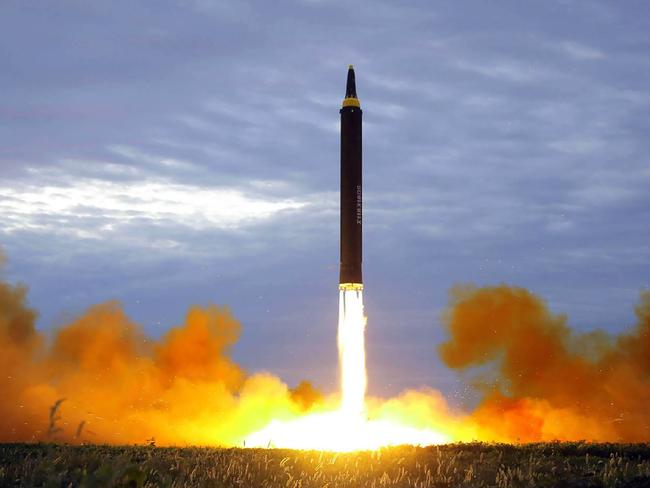 (FILES) This file photo from North Korea's official Korean Central News Agency (KCNA) taken on August 29, 2017 and released on August 30, 2017 shows North Korea's intermediate-range strategic ballistic rocket Hwasong-12 lifting off from the launching pad at an undisclosed location near Pyongyang. Nuclear-armed North Korea's testing of long-range missiles that could possibly reach US soil has kindled debate in Japan and South Korea about developing their own nuclear deterrent, prompting fears of a North East Asian arms race. / AFP PHOTO / KCNA VIA KNS / STR / South Korea OUT / REPUBLIC OF KOREA OUT   ---EDITORS NOTE--- RESTRICTED TO EDITORIAL USE - MANDATORY CREDIT "AFP PHOTO/KCNA VIA KNS" - NO MARKETING NO ADVERTISING CAMPAIGNS - DISTRIBUTED AS A SERVICE TO CLIENTS THIS PICTURE WAS MADE AVAILABLE BY A THIRD PARTY. AFP CAN NOT INDEPENDENTLY VERIFY THE AUTHENTICITY, LOCATION, DATE AND CONTENT OF THIS IMAGE. THIS PHOTO IS DISTRIBUTED EXACTLY AS RECEIVED BY AFP.   TO GO WITH NKorea-nucelar-missile-Japan-SKorea-politics, FOCUS by Shingo Ito and Park Chan-Kyong /