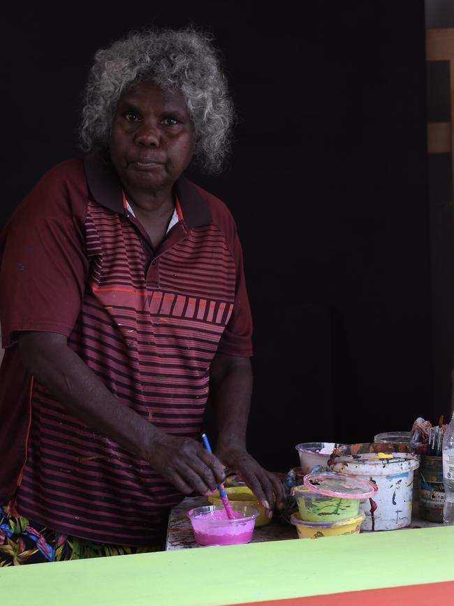 Ngukurr artist Jill Daniels painting in her studio at Ngukurr Arts Centre. Picture: (A)manda Parkinson