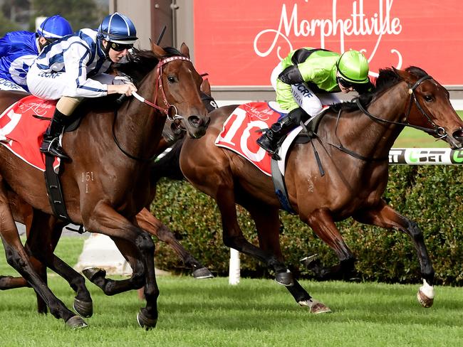 Damian Lane hits the line first on Amelie's Star in front of Emily Finnegan on Have Another Glass at Morphettville this month. Picture: Mark Brake