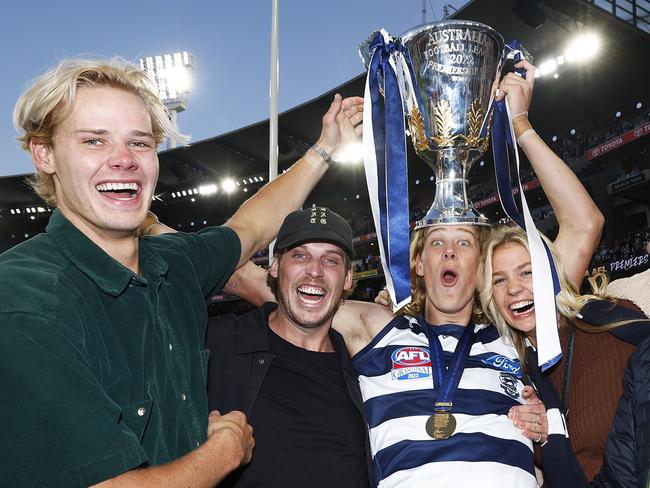 MELBOURNE, AUSTRALIA - SEPTEMBER 24: Sam De Koning of the Cats celebrates with family and friends after winning the 2022 AFL Grand Final match between the Geelong Cats and the Sydney Swans at the Melbourne Cricket Ground on September 24, 2022 in Melbourne, Australia. (Photo by Daniel Pockett/AFL Photos/via Getty Images)