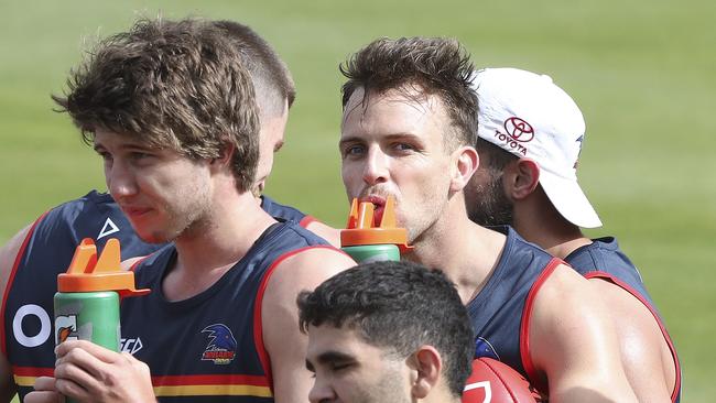 Jordan Butts (left) and Brodie Smith suck back some water during training prior to Christmas. Picture: Sarah Reed