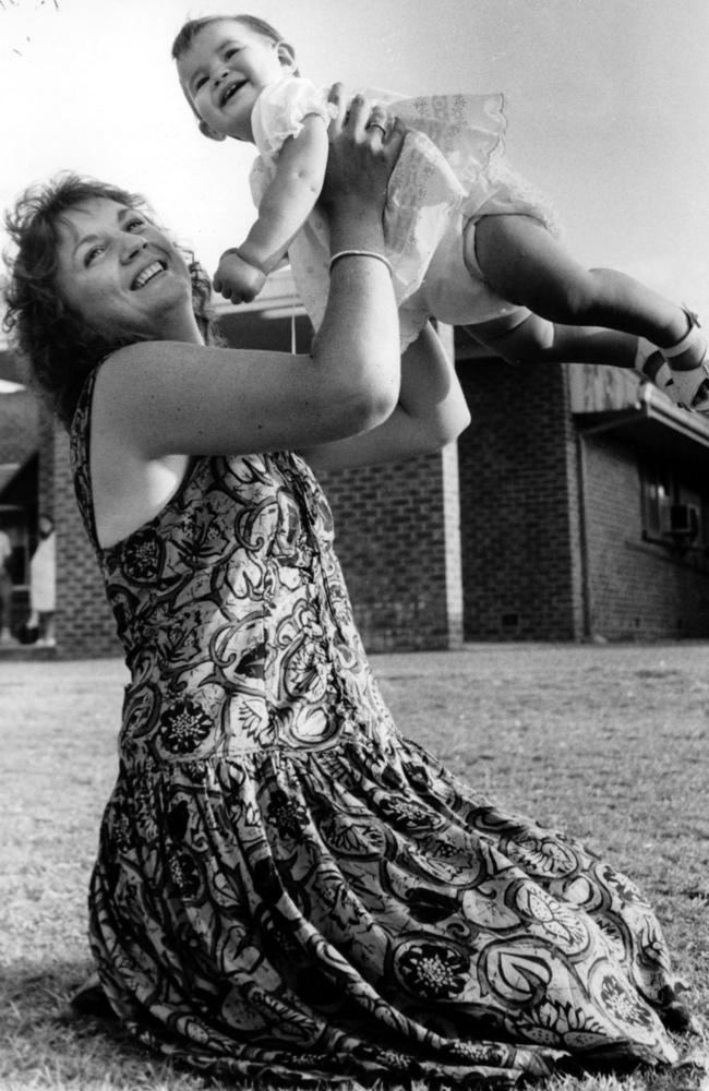 Danielle Easey and mum Jennifer Collier at the site of her birth on a lawn in 1989 during the Newcastle earthquake.