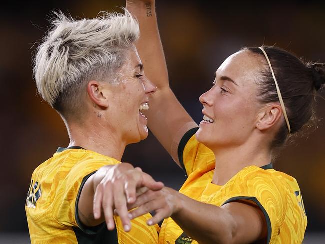 MELBOURNE, AUSTRALIA - FEBRUARY 28: Michelle Heyman of the Matildas celebrates a goal with team mare Caitlin Foord during the AFC Women's Olympic Football Tournament Paris 2024 Asian Qualifier Round 3 match between Australia Matildas and Uzbekistan at Marvel Stadium on February 28, 2024 in Melbourne, Australia. (Photo by Darrian Traynor/Getty Images)