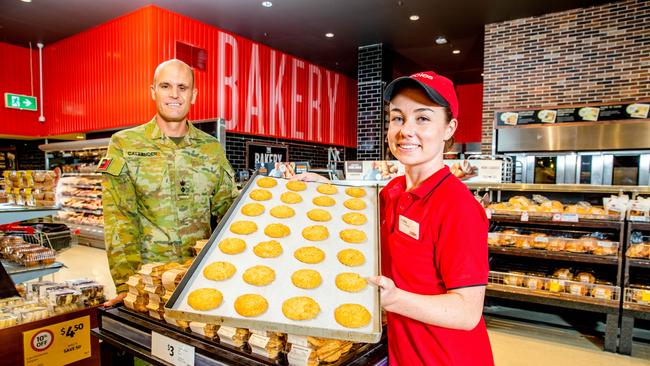 Chairman of Bravery Trust Lieutenant Colonel Garth Callender and Coles bakery manager Andie King.