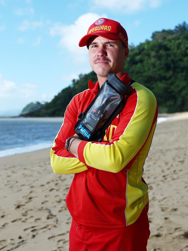 Trinity Beach was closed on Saturday morning when a small saltwater croc was seen swimming close to shore in the stinger net enclosure. Council lifeguard Arjan Wynberg erected a Danger - Beach Closed sign after spotting the crocodile. Picture: Brendan Radke