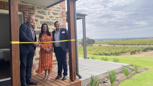 Barossa Mayor Bim Lange officially opens the estate with part owners Chris and Sandy Day. Picture: Jason Katsaras