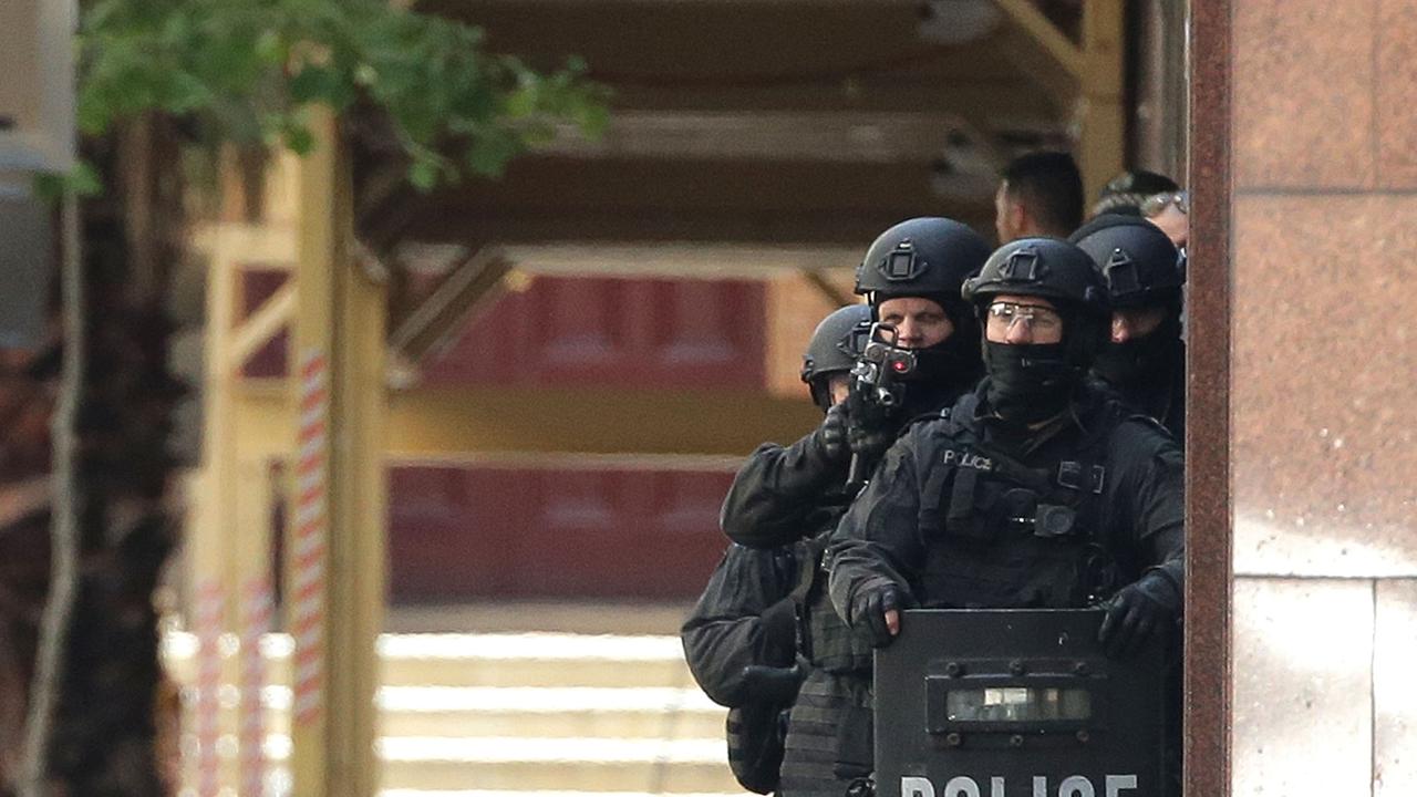 Armed police are seen outside the Lindt Cafe, Martin Place on December 15, 2014 in Sydney, Australia. Picture: Mark Metcalfe/Getty Images