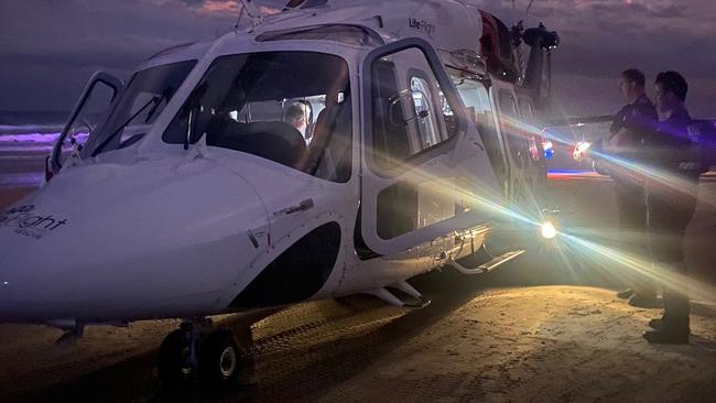 The RACQ LifeFlight Rescue helicopter crew has flown a man to hospital, after he came close to drowning at a Great Sandy National Park beach, on Friday April 7, 2023. Picture: RACQ LifeFlight