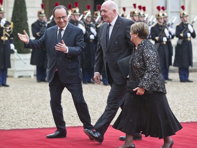 France's President Francois Hollande could not keep the smile off his face when welcoming Australian Governor-General Peter Cosgrove and his wife Lynne to the Elysee Palace. Picture: AP Photo/Michel Euler