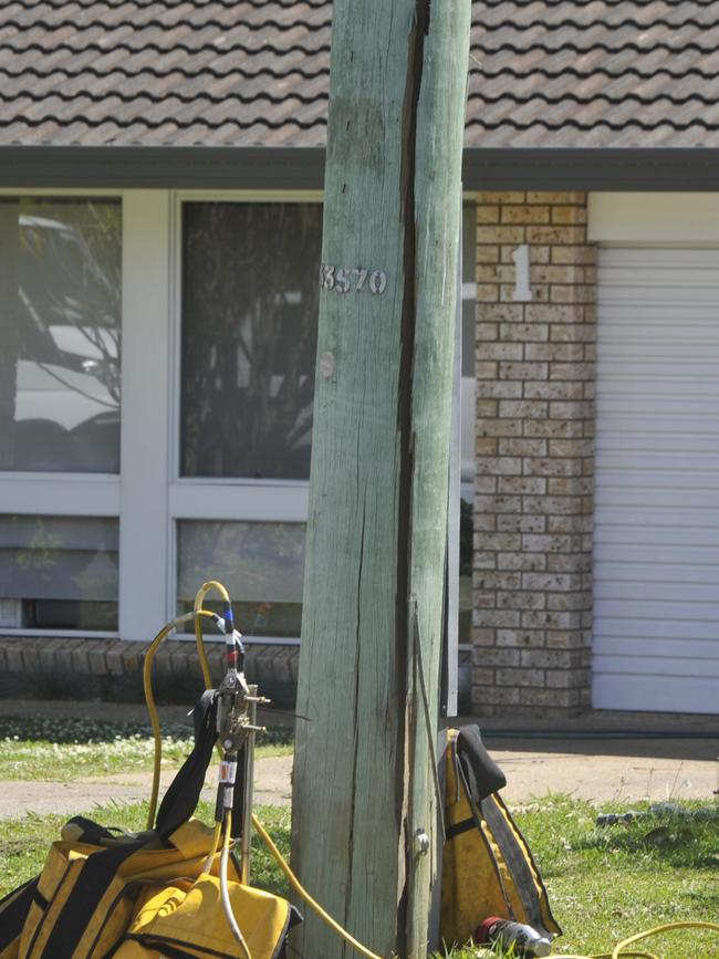 A resident said the power pole on Mackays Road “bent over” after a car crashed into it. Picture: Tim Jarrett