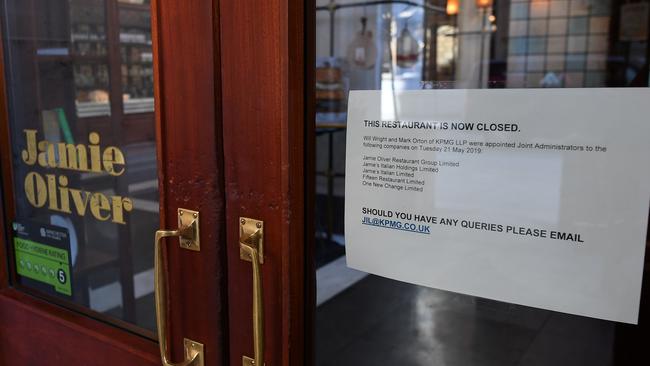 A sign on the door lets people know the restaurant is closed and that KMPG has been appointed as administrators. Picture: Paul Ellis/AFP