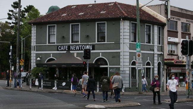 Sydneysiders are seen walking through Newtown on Monday's "freedom day". Picture: Getty Images