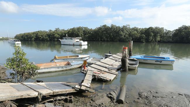 Dumped boats on our waterways near jetty in Bulimba Creek. Picture: Mark Cranitch.