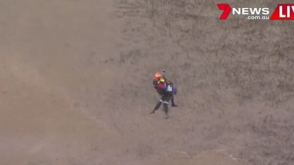 Emergency crews winch down to the scene. Photo: 7 News Brisbane